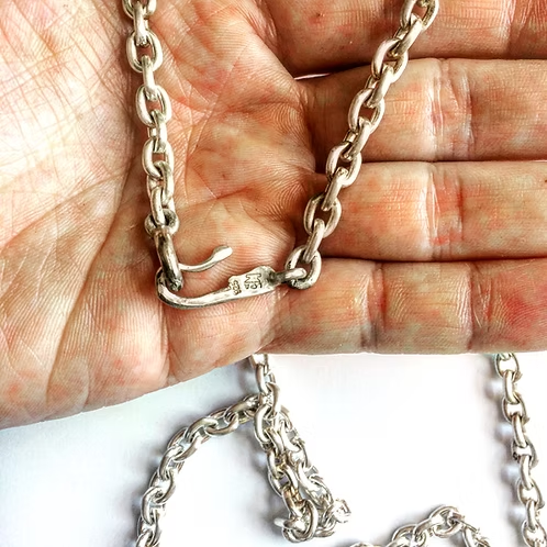 How Proportion and Chain Length Affect Cross Necklace Design